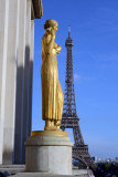 Gilded statue at the Palais du Chaillot with the Eiffel Tower