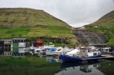 Waterfall behind the fishing harbor, Vestmanna, Faroe Islands