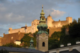 Evening in Salzburg - spire of St. Peters with Salzburg Castle
