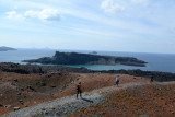 Tourists on the Tholos Naftilos crater rim path, Nea Kameni