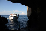 Tour boat entering the mouth of Neptunes Grotto to drop off a load of tourists