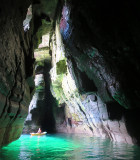 Aug 16 Sea kayaking NE Scotland near Dunbeath inside coastal cliff tunnel with sun 