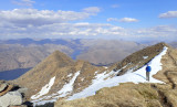 Summit of Ladhar Bheinn looking north over Loch Hourn with some lingering spring snow