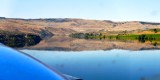Daher Kodiak floatplane glassy water landing on river, Washington 670