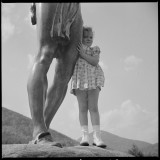 A little girl clinging to the bronze statue of an Indian on the Mohawk Trail in Massachusetts, FSA Oct 1941