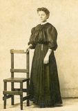 Lady Posing with a Chair  