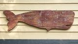 Wooden whale hanging.