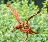 Rusty mosquito sculpture.
