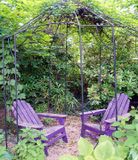 Seating area with purple chairs.