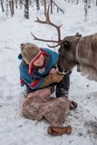 Anna Feeding her Reindeer