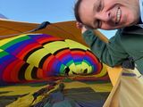 Matt helps to inflate the balloon.