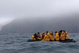 Only a zodiac rubber boat can take us close to the cliff