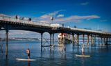 Under the pier.