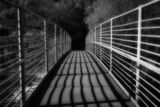 Shadows on a footbridge.