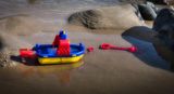 Run aground. Rescue attempts prove futile.