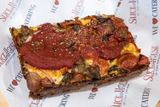 8/1/2025  Slice of Little Italy Detroit style deep dish pan crust with a crispy cheese edge