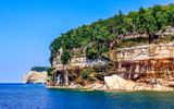 Rainbow cliffs with Indian Head in the distance in Pictured Rocks NL