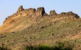 Sunrise on a rugged portion of the volcanic wall at Shiprock