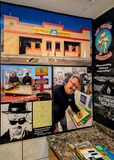 Breaking Bad images, including executive producer Vince Gilligan, on a wall at Twisters (Los Pollos Hermanos)