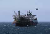 I saw a helicopter land on this oil rig tanker. 