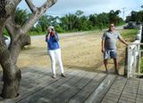 Our Ronys guide plus photographer #1 at Roatan sign at an overlook
