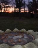 Sunset over the frozen birdbath