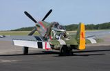 Getting belted in for his P-51 ride