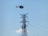 Helo carries works to the job closer view