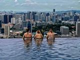 Infinity Pool of Sands Hotel facing Singapore city from 57 levels above