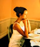 Young woman dining at sunset.