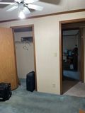 L-to-R: second bedroom closet door, room door, and the door to the third bedroom across the hall.