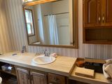 Primary bathroom vanity needs work!  Shower in mirror has leak, so it and the floor need to be replaced.
