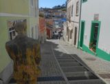 Monchique looking downhill along pedestrianised shooping area with statues
