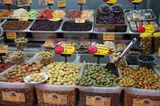 Olives and other produce tempt shoppers at the market
