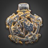 Borre style gripping beast pendant, silver gilt with niello, 4 cm