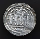 Early Danish semibracteate, 10th century, thought to be Hedeby mint. Hauberg 1, KG9, after Carolingian Dorestat denier
