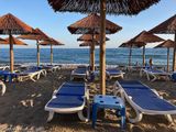 In a bar, looking to the sea