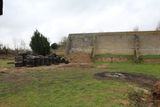 Old tyres were used to make a fence between ranges. Was a failure, was removed