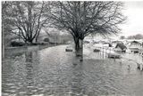 High tide on road at Richmond Lock