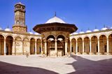 The courtyard of the mosque and the clock tower