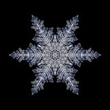 Kaleidoscopic snowflake created with a real natural frost structure