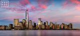 PANORAMIC SKYLINE OF LOWER MANHATTAN AND WORLD TRADE CENTER AT DUSK