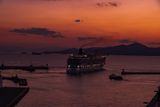 CRUISE SHIP LEAVING  THE PORT AT SUNSET