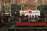 The two panels of the triptych (weighing 1,000 pounds each) were opened by this tiny nun