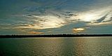 Sun setting behind clouds on the Amazon