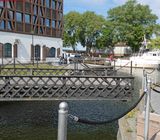 Watching the manually operated rotating bridge in Klaipeda swing open