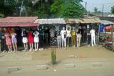 Clothing vendors along the road in Ivory Coast.JPG