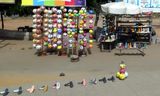 Soccer balls and shoes for sale along the road in Loma, Togo.JPG