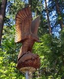 Wooden eagle with fish
