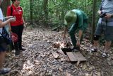SOLDIER SHOWS HOW SNIPERS COULD HIDE IN THE FOREST FLOOR FOR AMBUSHES
